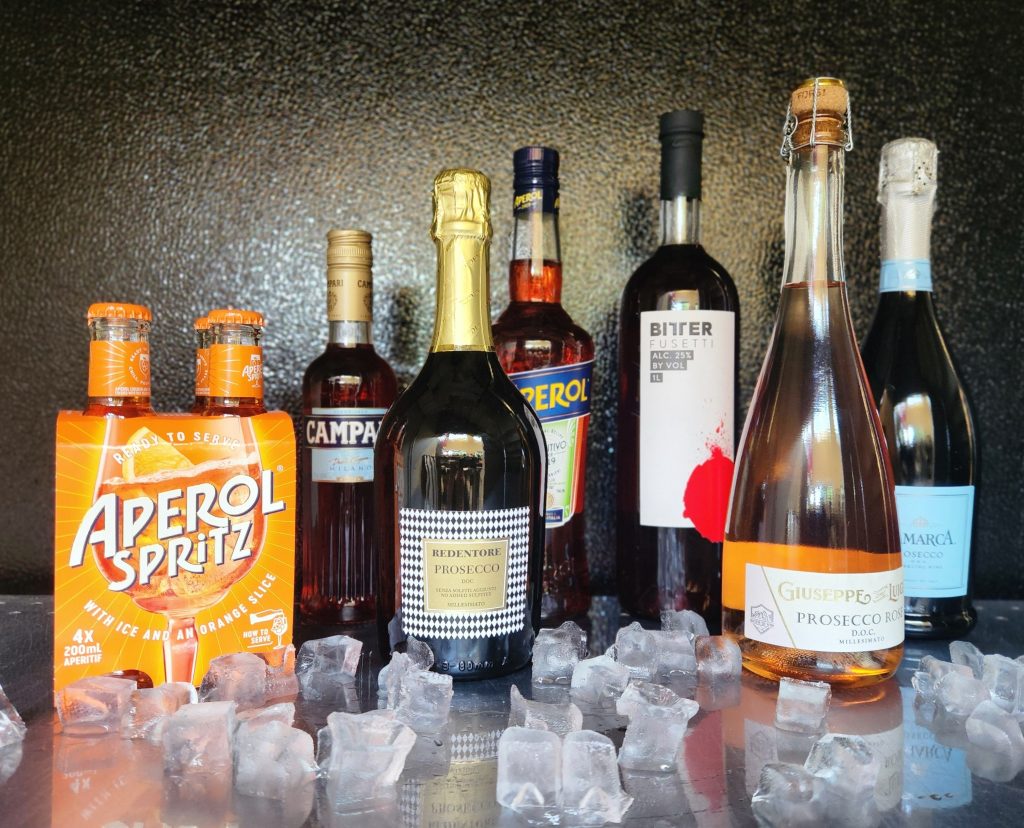 Ingredients for the Aperol Spritz cocktail lined up at Bullfrog Wine & Spirits in Fort Collins