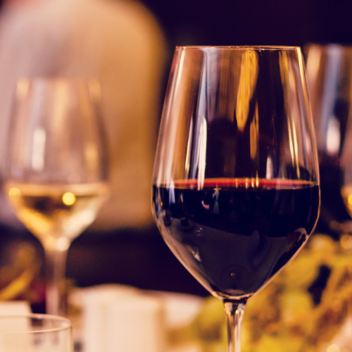 Close-up of red and white wine glasses at a wine tasting event, ideal for holiday gatherings and gift inspiration---Bullfrog wine tasting events.